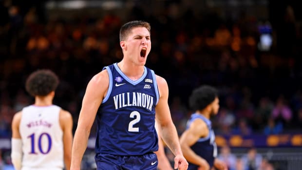 Villanova Wildcats guard Collin Gillespie (2) reacts after a play against the Kansas Jayhawks during the first half during the 2022 NCAA men's basketball tournament Final Four semifinals at Caesars Superdome.